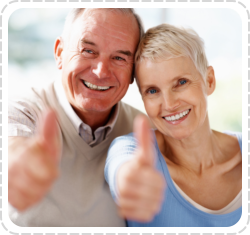 an old couple doing two thumbs-up